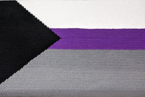 A top down view of the demisexual pride flag blanket